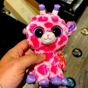1 TY beanie baby named “Twigs”.